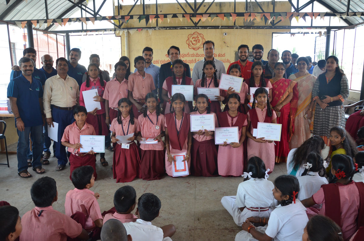 Award ceremony with students holding certificates